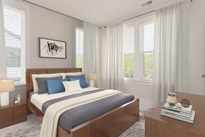Sandy Springs triplex for rent - A bedroom with a large bed and a painting on the wall.