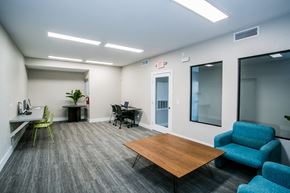Las Vegas apartment for rent - an office space with chairs and tables and a desk