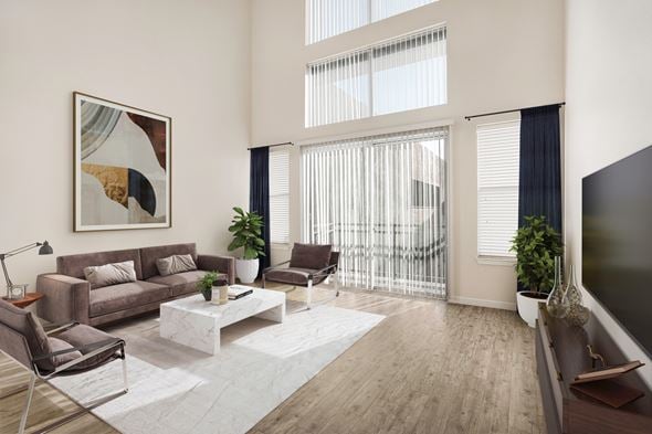 Las Vegas apartment for rent - A living room with a brown couch, a white coffee table, and a painting on the wall.