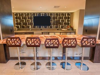 Social lounge with kitchen, gaming room and televisions