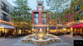 Petaluma apartment for rent - A clock tower is at the center of a courtyard with a fountain.