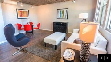 Petaluma apartment for rent - A living room with a black chair and a white couch.