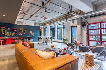 Indoor/outdoor base camp gaming room - casual bike, sauna & makers lounge
