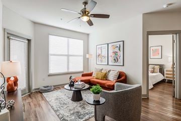 Nashville apartment for rent - a living room with a couch and a ceiling fan