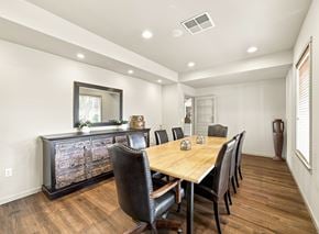 Coeur D Alene apartment for rent - A dining room with a wooden table and chairs.
