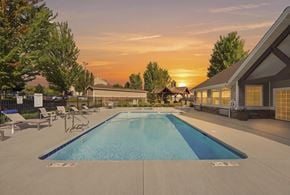 Spokane apartment for rent - A large swimming pool with a sunset in the background.