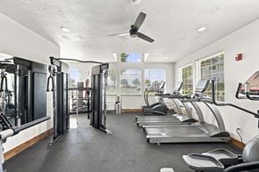 Spokane apartment for rent - A gym with treadmills, weights, and a fan.