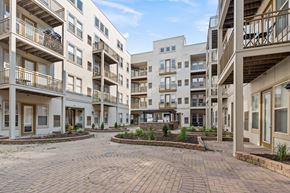 Minneapolis apartment for rent - A courtyard surrounded by apartment buildings with a clear blue sky.