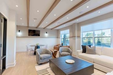 Fairfield apartment for rent - A modern living room with a wooden coffee table and a white sofa.