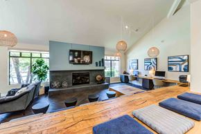 Rancho Cucamonga apartment for rent - A modern living room with a fireplace and a television.