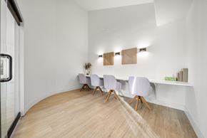 Aurora apartment for rent - A conference room with a long table and chairs.
