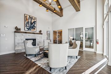 Travelers Rest apartment for rent - A modern living room with a fireplace and a large painting on the wall.