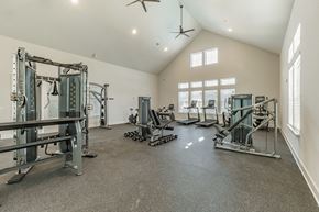 Travelers Rest apartment for rent - the standard at pinestone travelers rest sc apartment community property photo of fitness center gym with high ceilings and ceiling fans and cardio and strength training equipment and free weights
