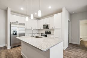 Travelers Rest apartment for rent - A kitchen with a granite countertop and stainless steel appliances.