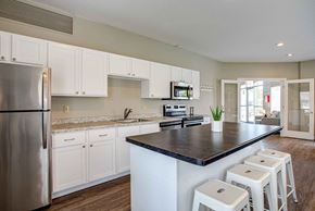 Hermantown apartment for rent - a kitchen with white cabinets and a counter top