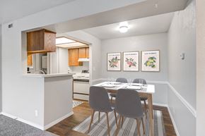 Kansas City apartment for rent - a dining room with a table and chairs and a kitchen