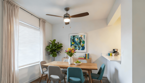 Everett apartment for rent - A dining room with a table set for two and a ceiling fan.