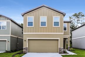 Deland apartment for rent - A modern house with a garage door in the front.