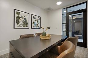 Denver apartment for rent - a dining room with a wooden table and chairs