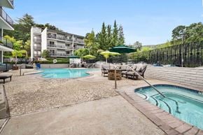 Los Gatos apartment for rent - Apartment Los Gatos, CA - El Gato Penthouse - Resort Style Pool And Spa Courtyard With Lounge Seating, Umbrella Tables, Apartment Balconies, And Tree Lined Hills.