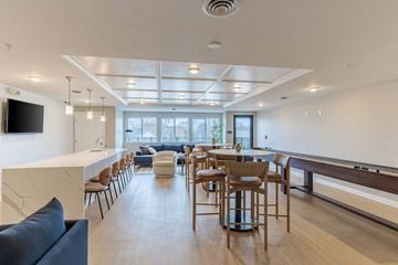 Blaine apartment for rent - A modern living room with a long wooden table and chairs.