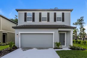 Deland apartment for rent - A modern house with a grey garage door.