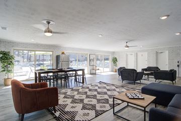 Atlanta apartment for rent - a living room with couches and chairs and a rug