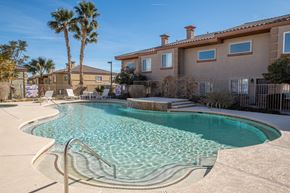 Las Vegas apartment for rent - a swimming pool with a building in the background