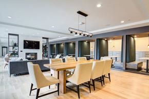 Bloomington apartment for rent - A modern dining room with a long table and chairs.