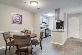 Duluth apartment for rent - Dining room adjacent to kitchen at Flats at River View apartments in Duluth, GA, near Lawrenceville.