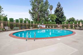 Fremont apartment for rent - a swimming pool with a fence around it