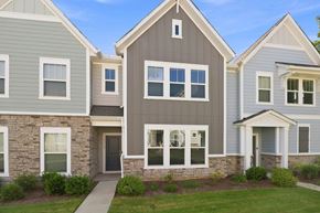 Charlotte townhouse for rent - A row of houses with different shades of grey and white.