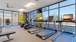 Scottsdale apartment for rent - A gym with treadmills and a fan.