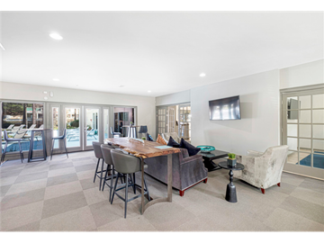Clarkston apartment for rent - a living room with a couch and a table with chairs