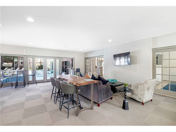 Clarkston apartment for rent - Spacious clubroom featuring cozy seating areas at Springdale Glen, a pet-friendly community in Clarkston, GA, near Decatur.