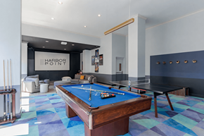 Stamford apartment for rent - A pool table in a room with a sign that says Harbor Point.