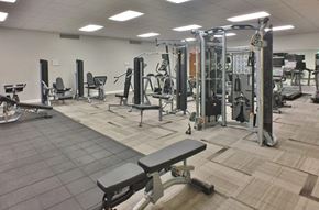 Washington apartment for rent - A gym with a variety of equipment including weights and benches.