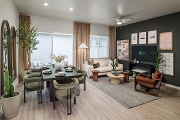 Prescott apartment for rent - A modern living room with a dining table set for six.