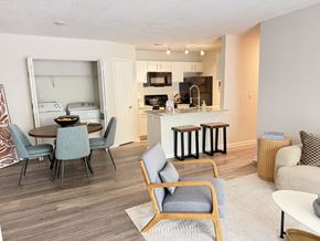 Greensboro apartment for rent - A modern kitchen with a dining table and chairs.