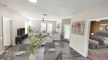 Orlando apartment for rent - A living room with a grey couch and a television.