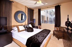 Las Vegas apartment for rent - a bedroom with a bed and a mirror