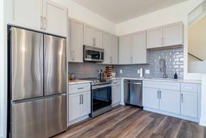 Atlanta apartment for rent - Gourmet island kitchen with sleek stainless-steel appliances at La France Square in Atlanta, GA, in a pet-friendly community.