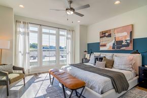 Atlanta apartment for rent - Luxury Atlanta, GA Homes – LaFrance Square – A bedroom with a large bed and a ceiling fan.