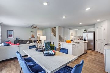 Fort Wayne townhouse for rent - a living room with a kitchen and a dining table