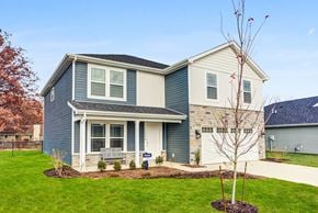 Fort Wayne townhouse for rent - a blue and white house with a lawn and a driveway