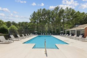 Calera apartment for rent - Outdoor swimming pool with lounge chairs at Lancaster Place Apartments in Calera, AL offering a relaxing community amenity near Interstate 65.