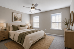 Calera apartment for rent - Spacious primary bedroom at Lancaster Place Apartments in Calera, Alabama featuring large windows, neutral finishes, and abundant natural light.