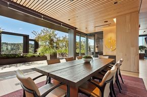 Portland apartment for rent - a dining room with a wooden table and white chairs