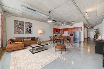 St. Louis apartment for rent - A living room with a brown couch and a coffee table.