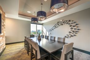 Dallas apartment for rent - A modern dining room with a large table and chairs.